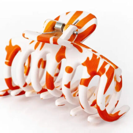 burnt orange and white hair accessory
